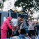 Personel Polres Cimahi menyalurkan air bersih menggunakan water cannon kepada warga terdampak kemarau.