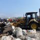 Petugas membersihkan material sisa kebakaran di Pasar Andir, Bayongbong, Garut.